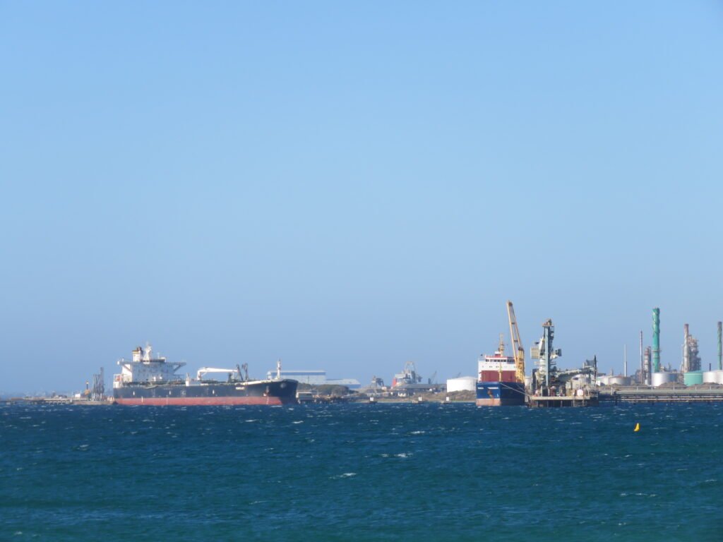 Crude oil tanker docked at a refinery jetty