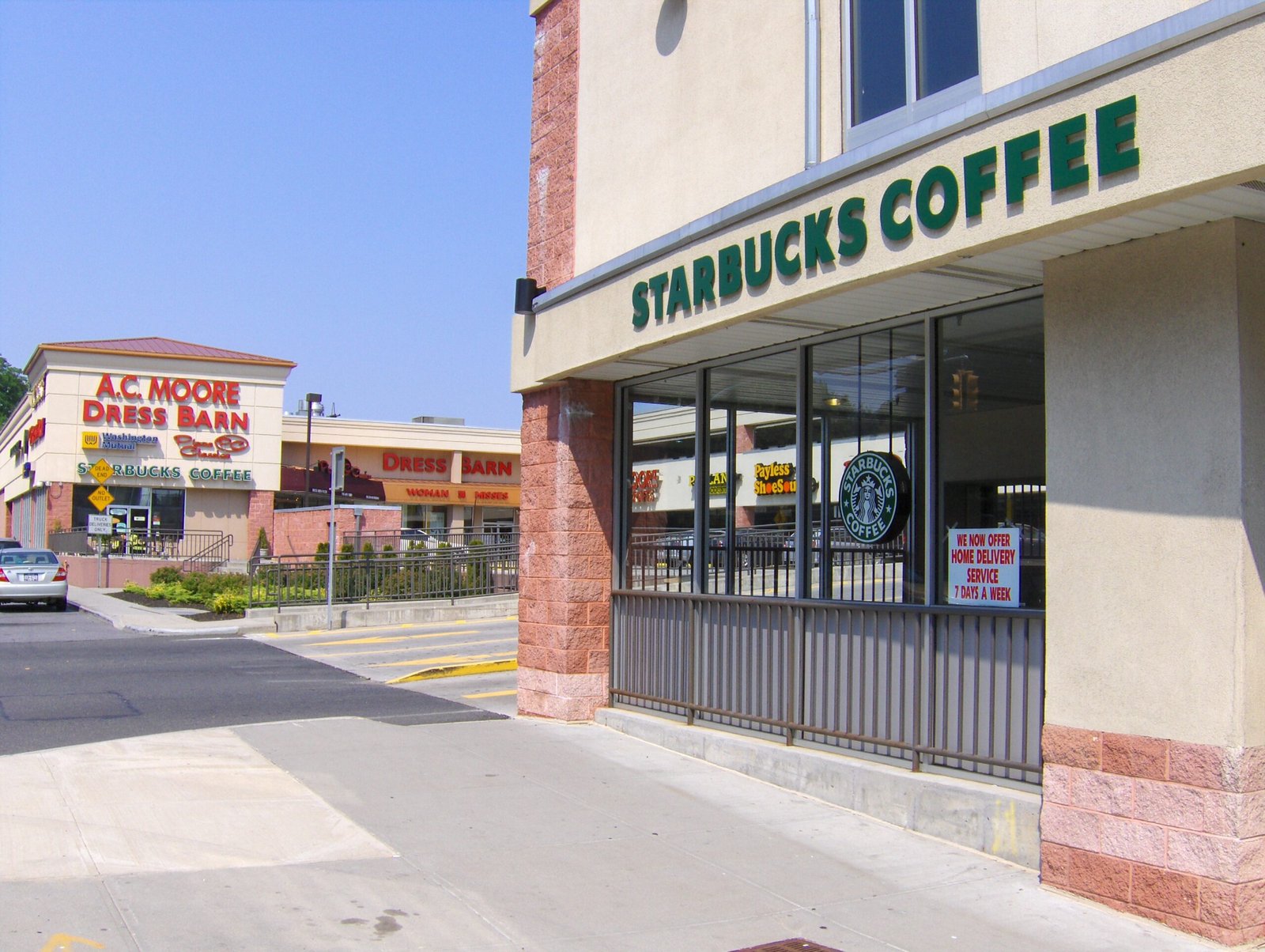 Two Starbucks store storefronts